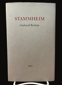 The image shows the cover of an artist book titled 'Stammheim' by Gerhard Richter, published by Anthony d'Offay Gallery in 1995. The cover is in a neutral gray tone with red and black text, featuring the title and the artist's name.