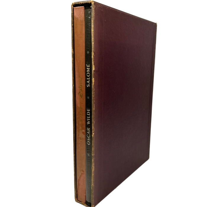 Vintage book titled 'Salome' by Oscar Wilde with a brown leather cover on a white background